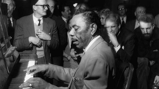 Champion Jack Dupree at piano.